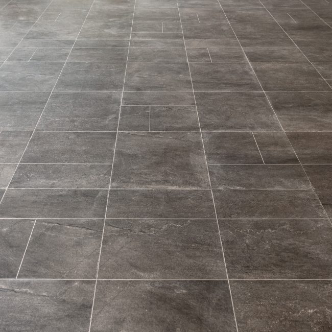 Gray marble rectangular tiles flooring pattern surface texture. Close-up of interior design decoration background